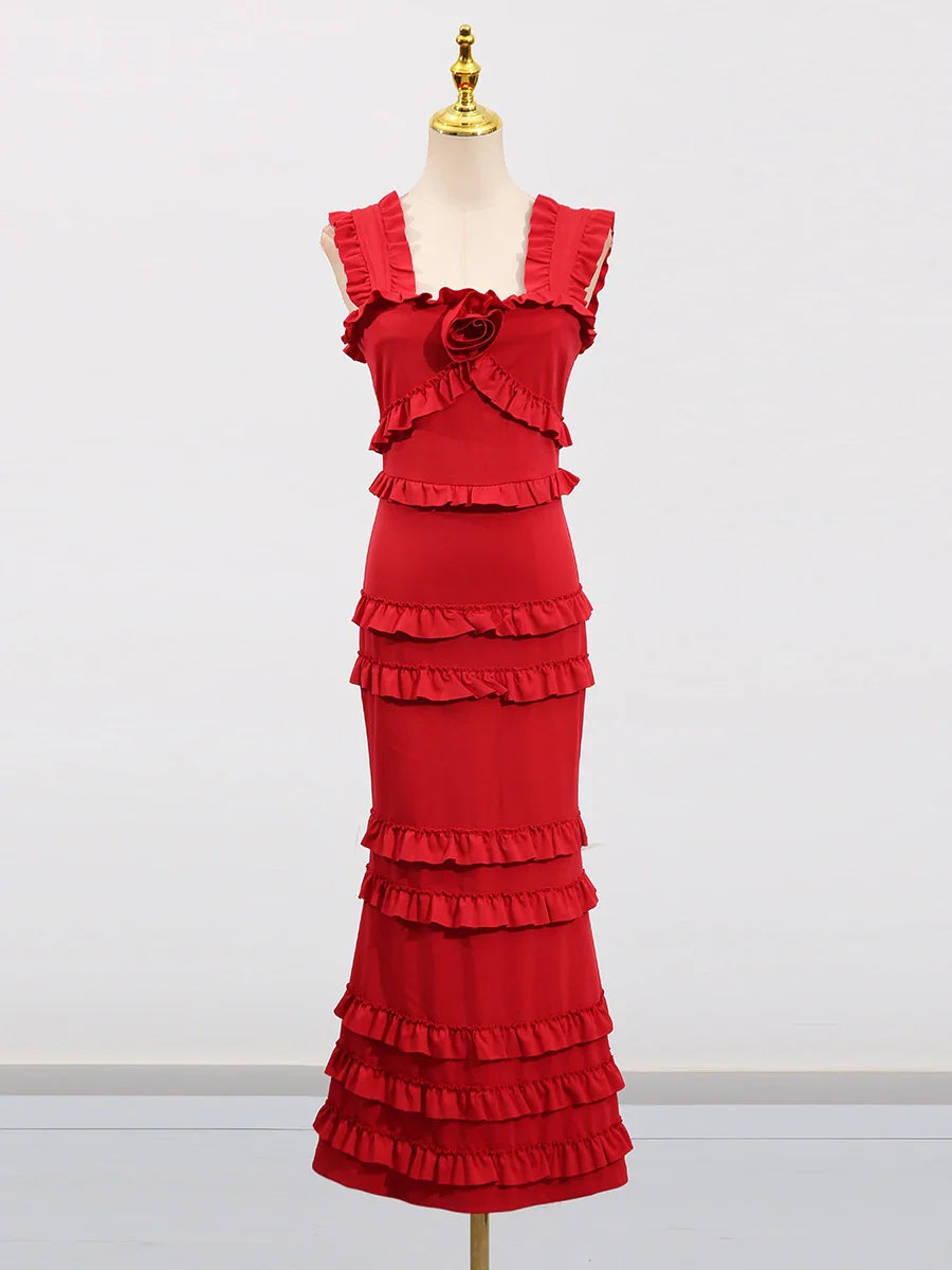 Red ruffled dress on a mannequin against a white background