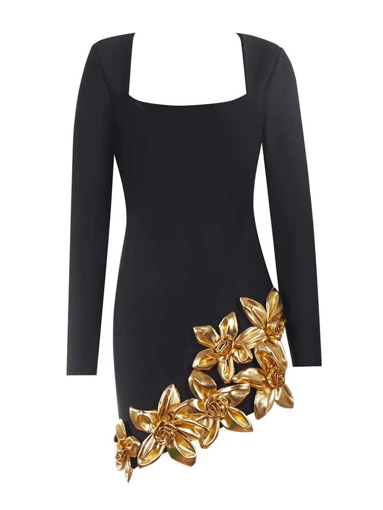 Black dress with gold floral embellishments on a white background