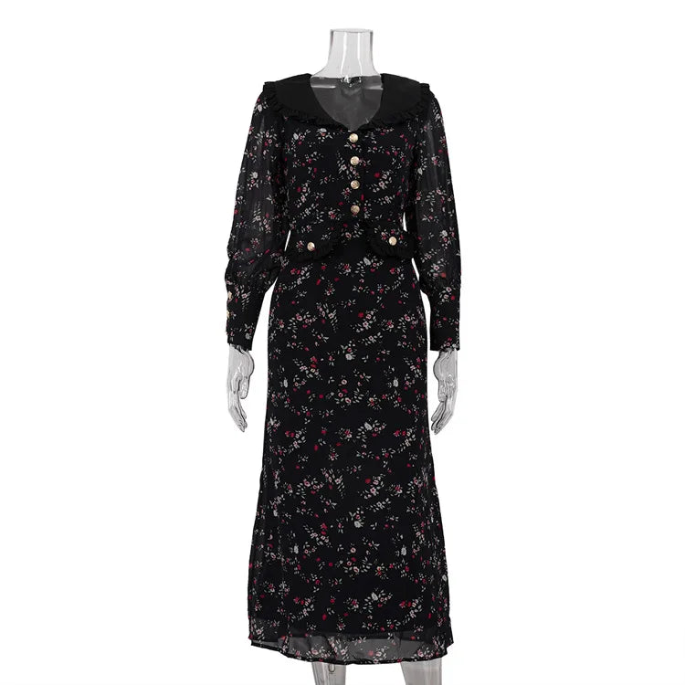 Black floral dress on a mannequin against a white background