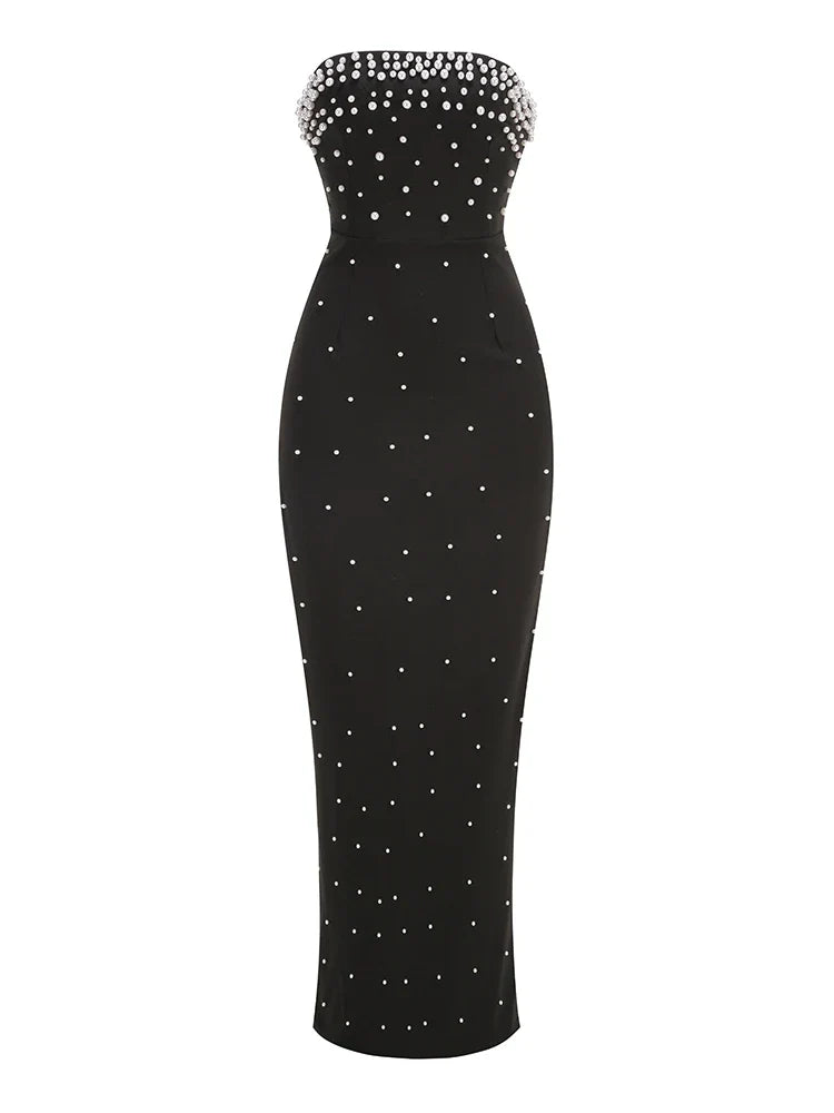 Black strapless dress with white bead embellishments on a white background