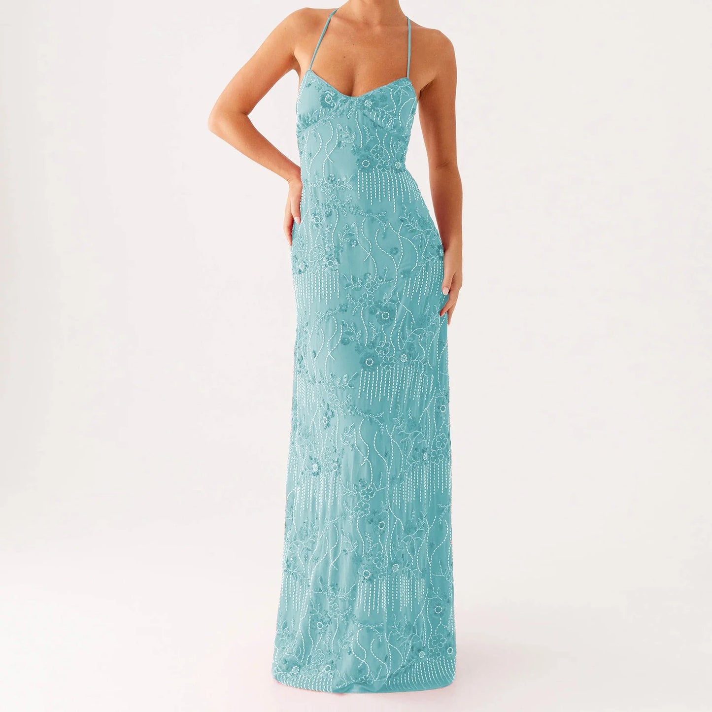 Teal lace dress on a white background