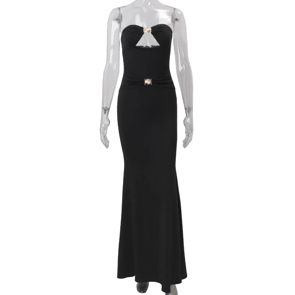 Black evening gown on a mannequin against a white background