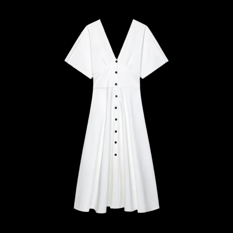 White dress with black buttons on a black background