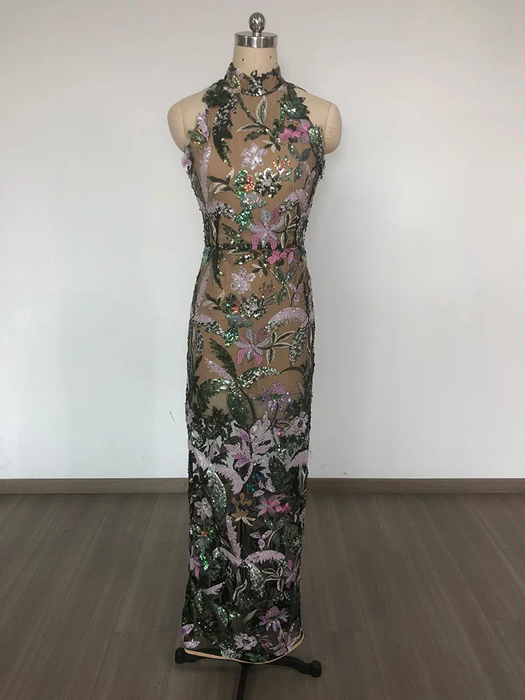 Floral sequin dress on a mannequin against a plain background