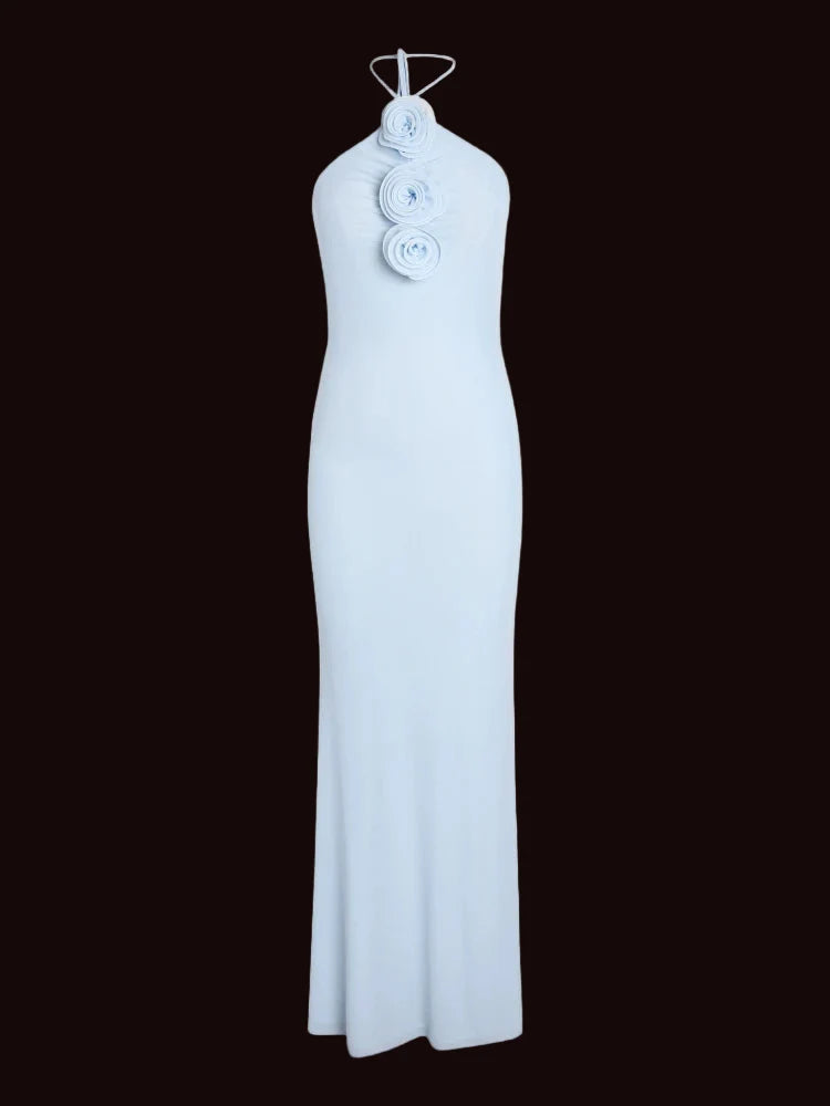 Light blue halter neck dress with floral details on a white background