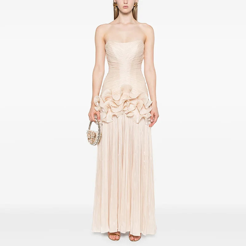 Woman wearing a strapless, ruffled gown 