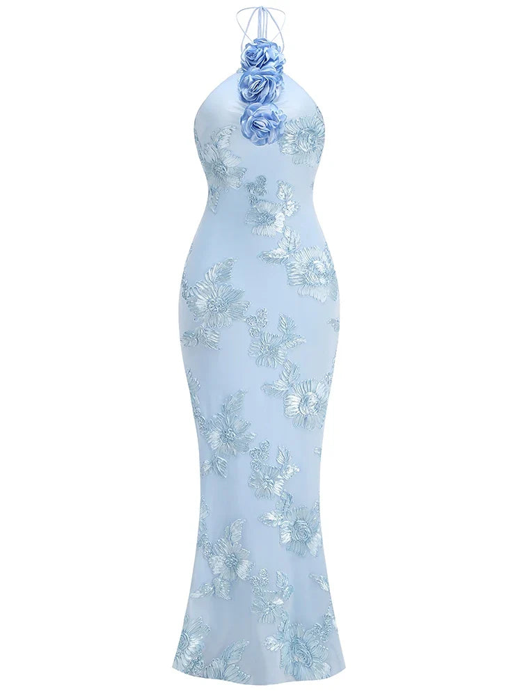Light blue evening gown with floral embellishments on a white background
