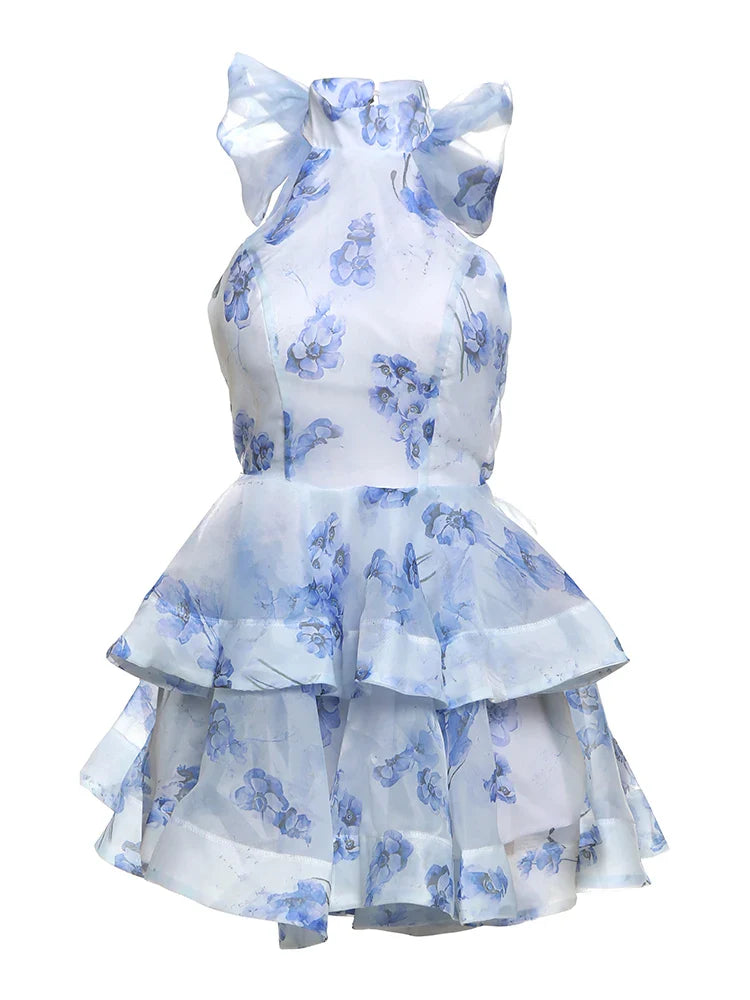 White dress with blue floral patterns on a white background