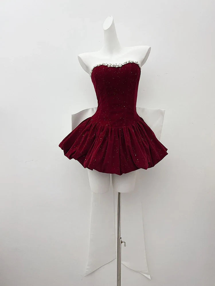 Red dress on a mannequin against a white background