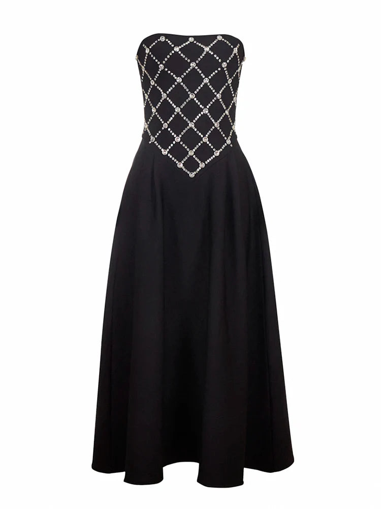 Black strapless dress with silver embellishments on a white background