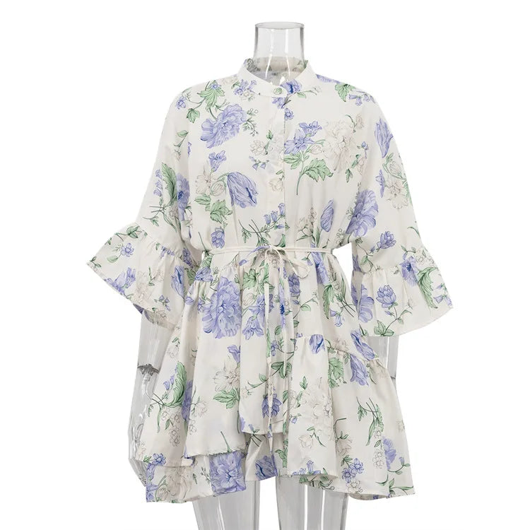 Floral dress on a mannequin against a white background