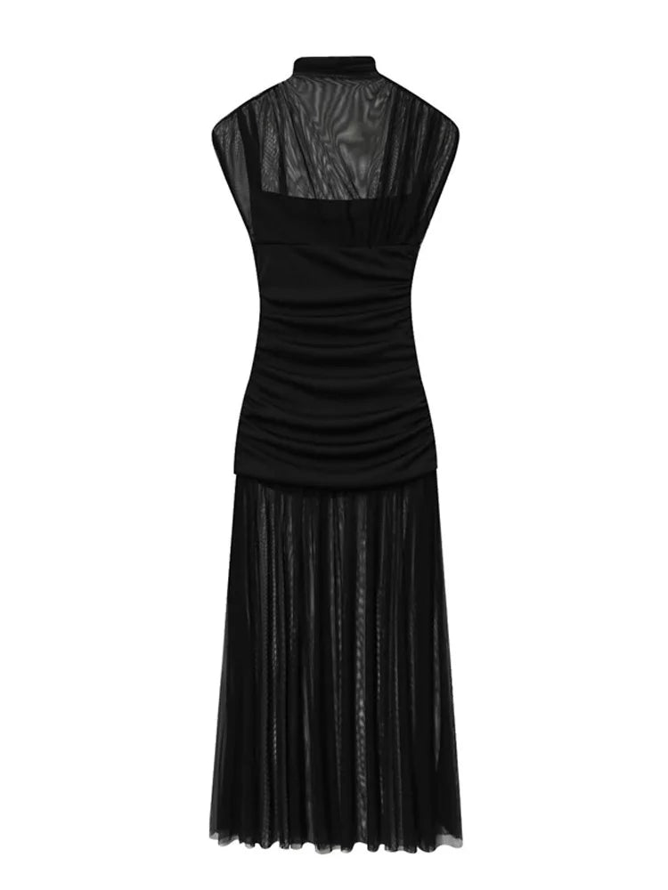 Black dress with leather-like texture on a white background
