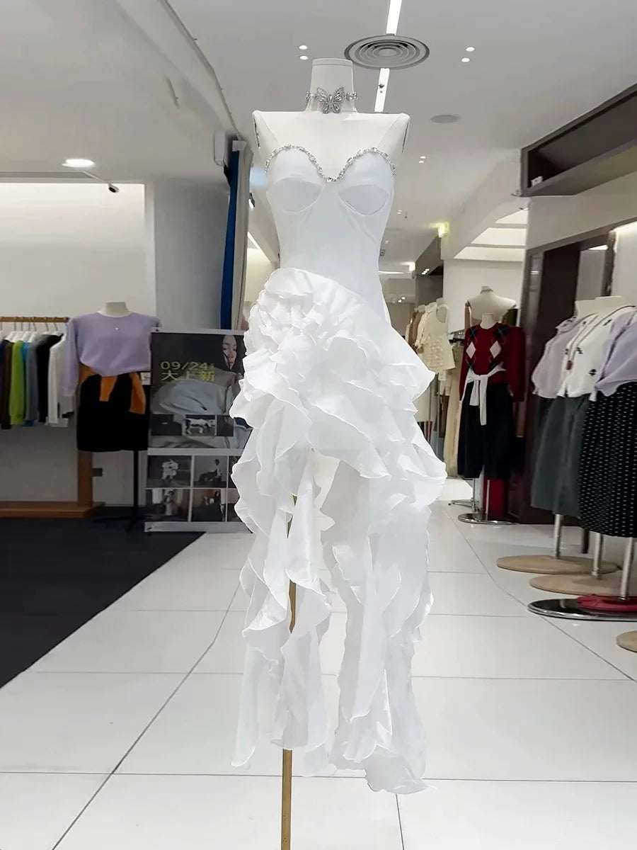 White ruffled dress on a mannequin in a clothing store setting