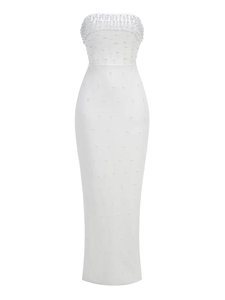 White strapless dress with beaded top on a white background