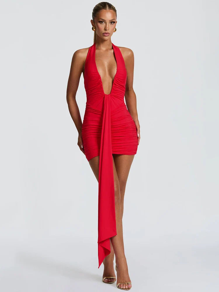 Red halter neck dress with a deep neckline and high slit 