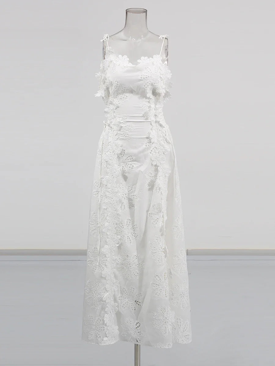 White lace dress on a mannequin against a gray background