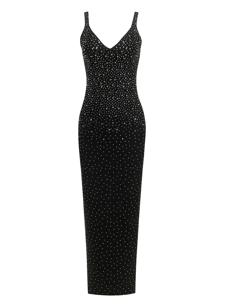 Black dress with white polka dot pattern on a white background
