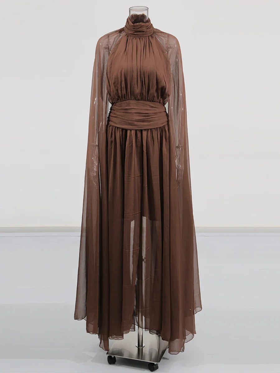 Brown dress on a mannequin against a white background