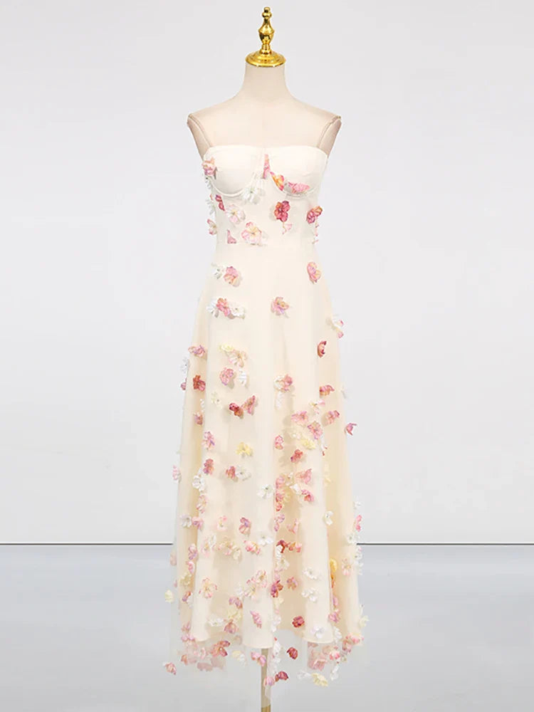 Floral dress on a mannequin against a white background