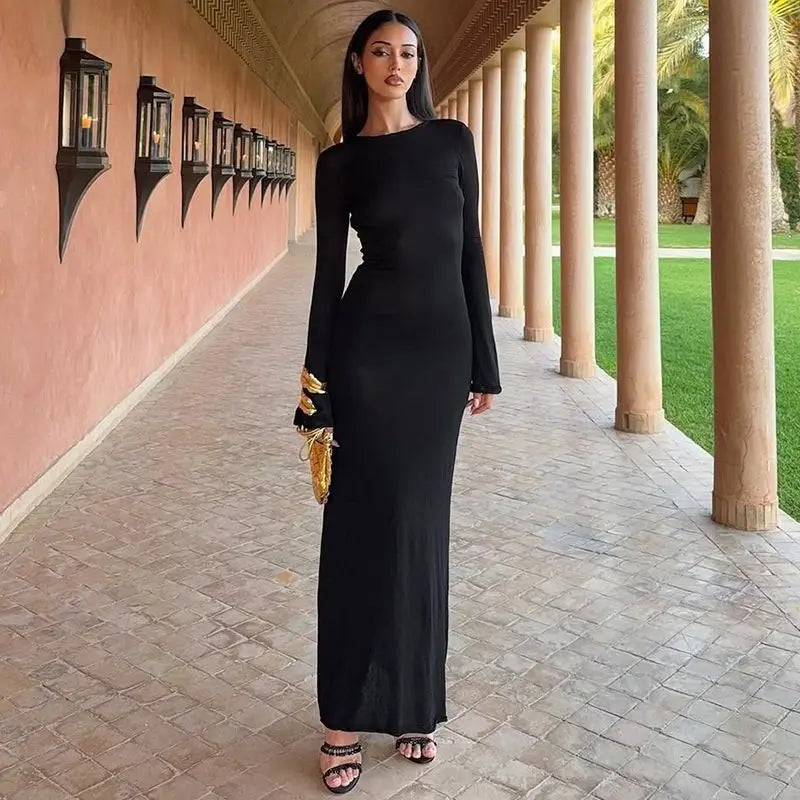 Ankle length knit black dress with gold accents for winter partywear