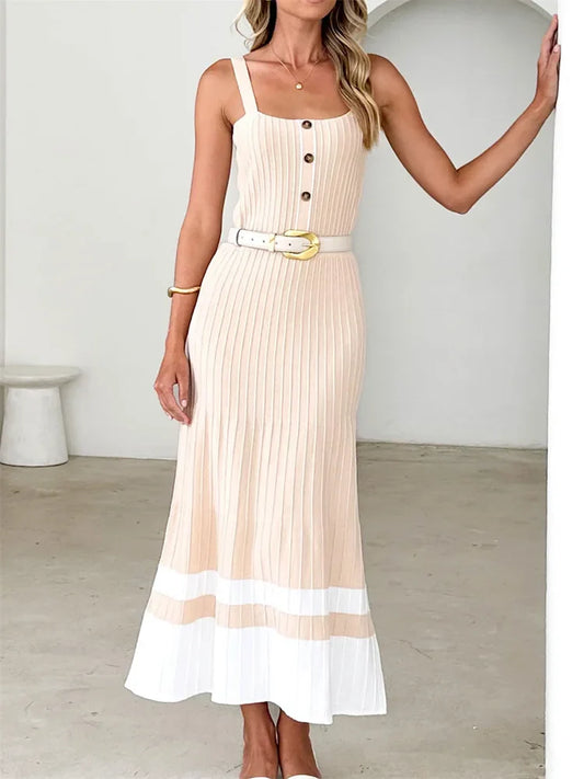 Woman in beige ribbed knit midi dress with white hem and buttons