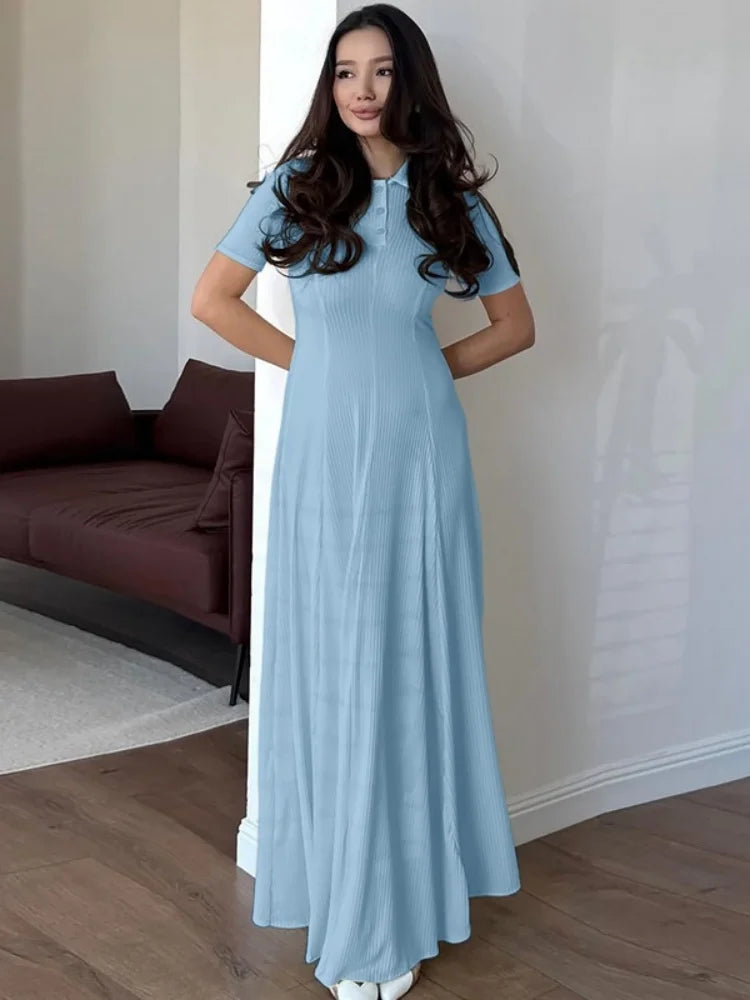 Long blue dress with button detail and turn-down collar for women