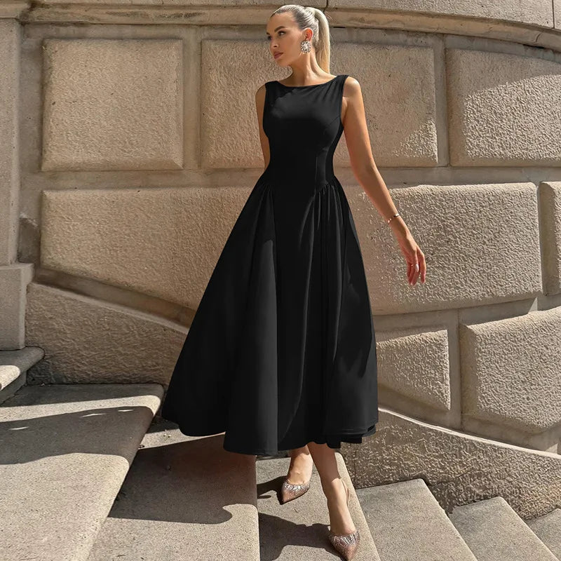 A woman modeling an elegant A-line dress with a classic O-neck.