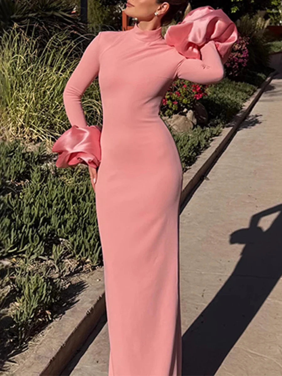High-neck formal dress in soft pink with sculptural silhouette