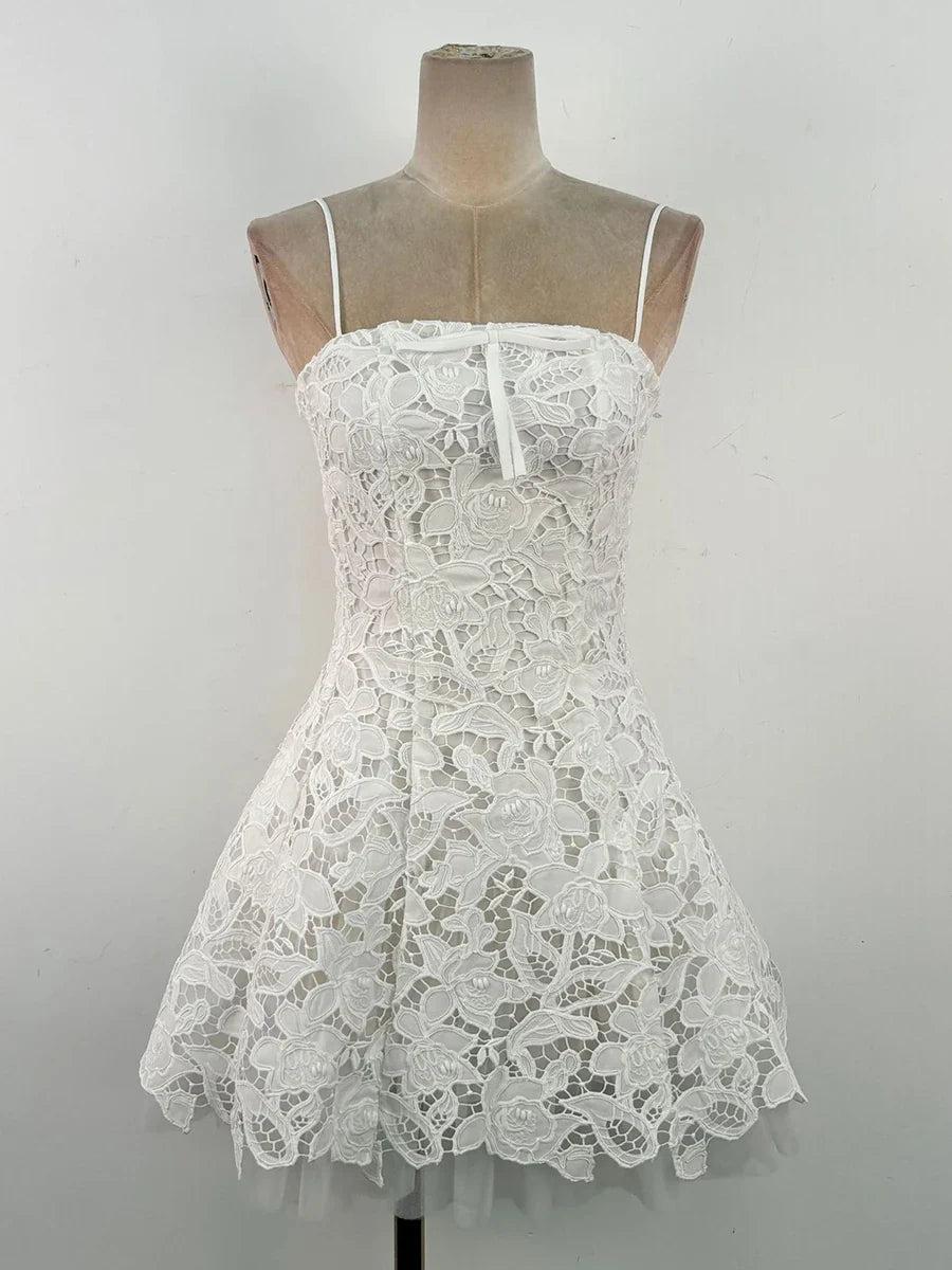 “Mini lace dress styled for summer party with heels and bag”  