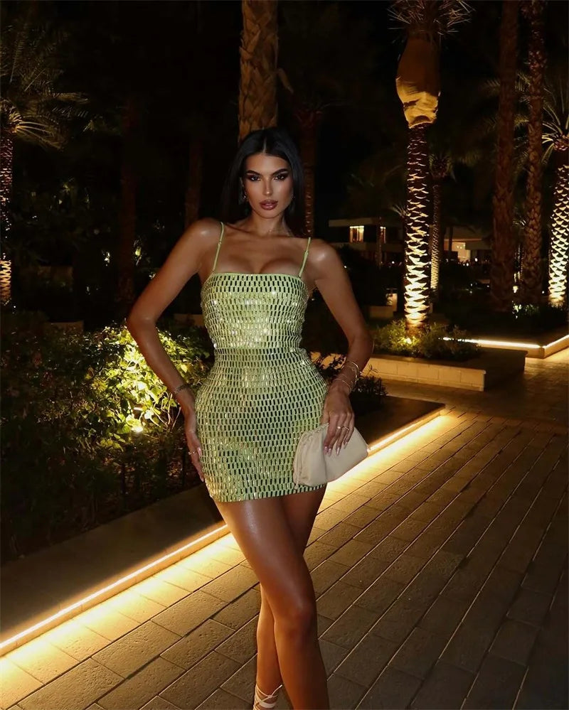 Lime green sequin mini dress styled for bold vacation outfits