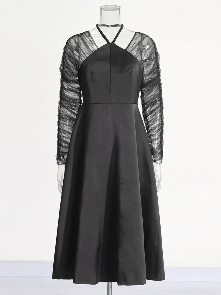 Modern club semiformal black dress with halter neckline  