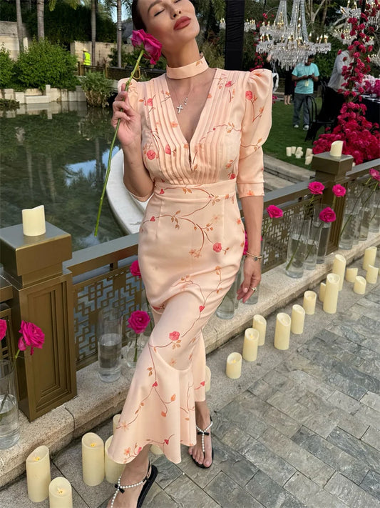 Peach floral midi dress with puff sleeves and lace-up waist, front view