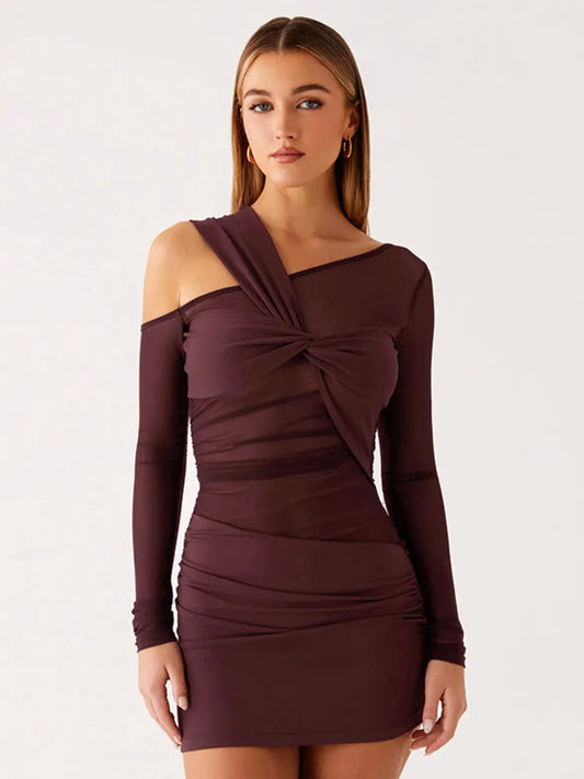 Woman wearing a burgundy off-shoulder dress on a white background
