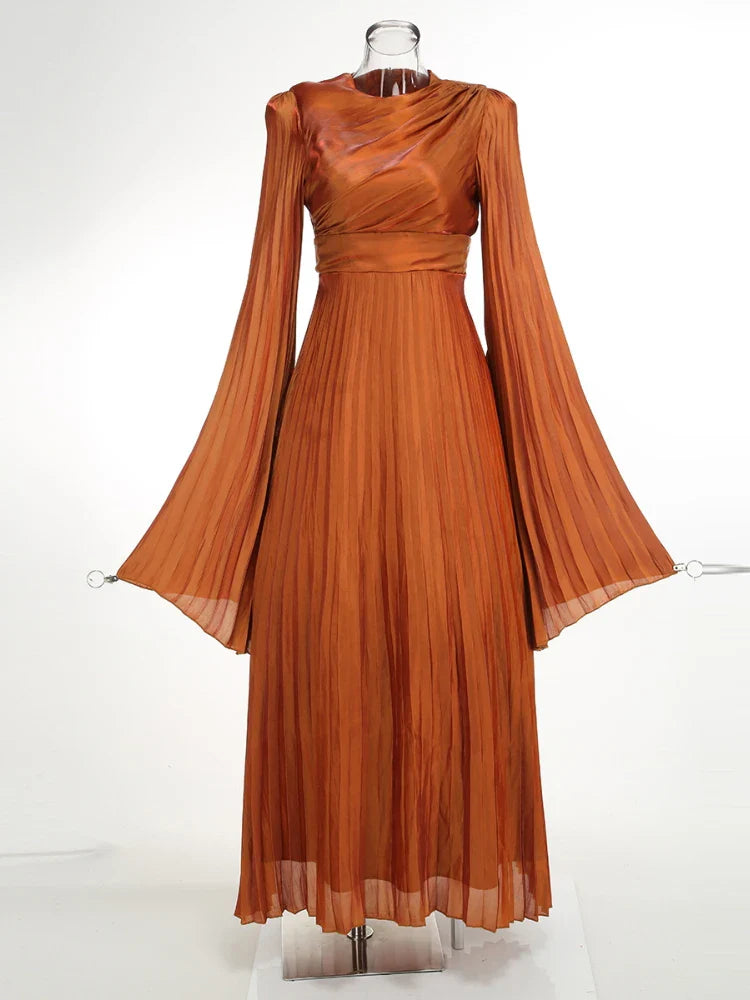 The slim fit of the dress, highlighting its flattering silhouette.