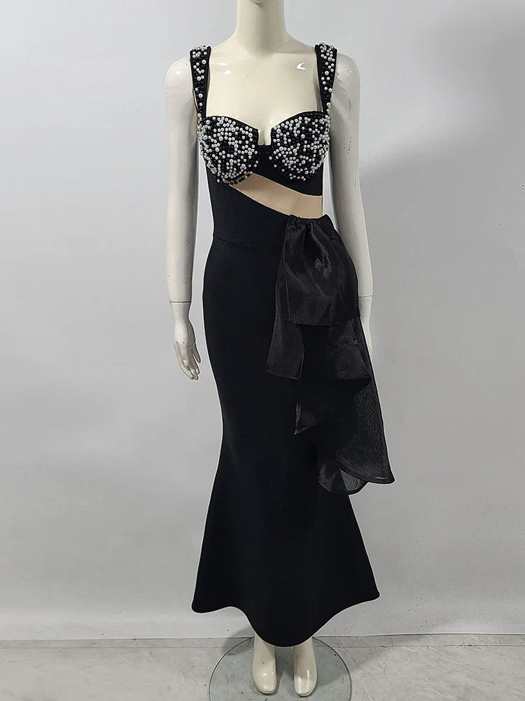 Spaghetti strap black gala dress styled for upscale formal events