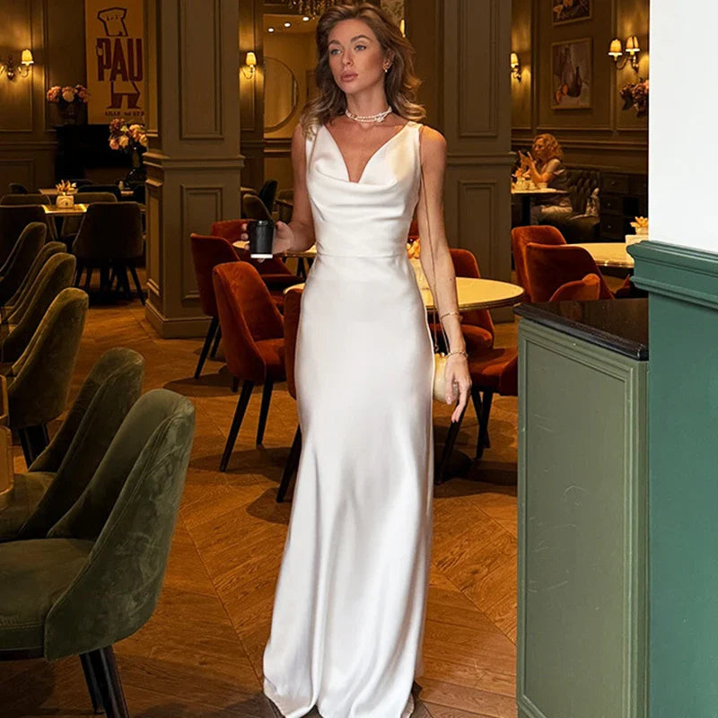 White cowl neck slip dress styled for elegant events and dinners