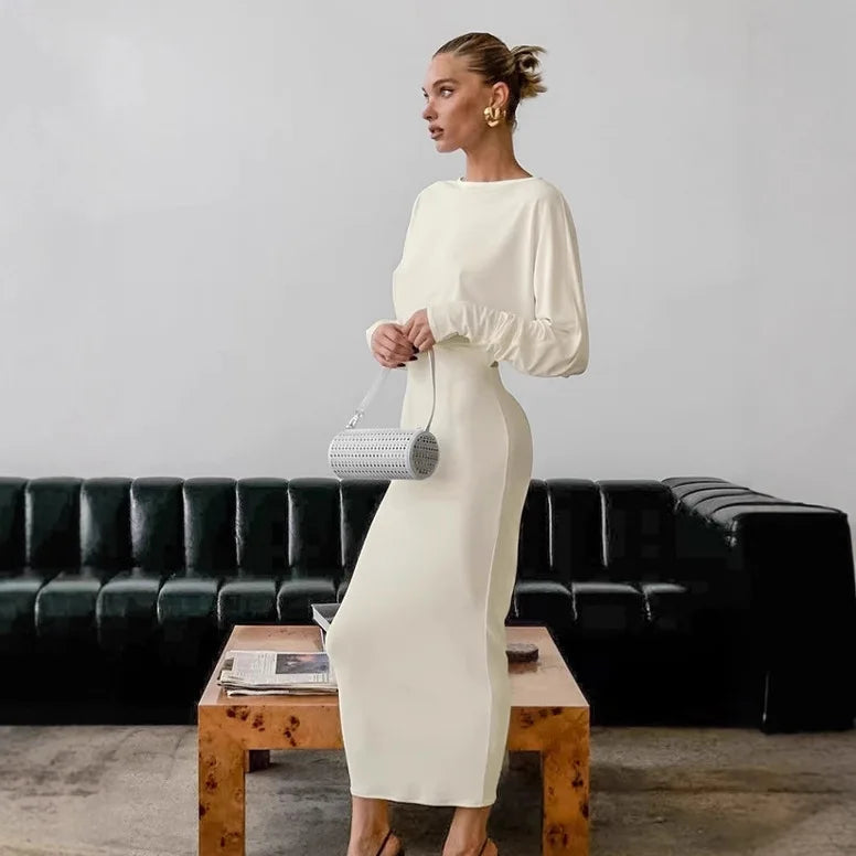 White puff sleeve open back maxi dress styled for modern events