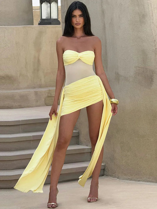 Woman wearing a Yellow strapless mini dress with high slit and ruched front.